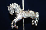 The Armored Carousel Horse